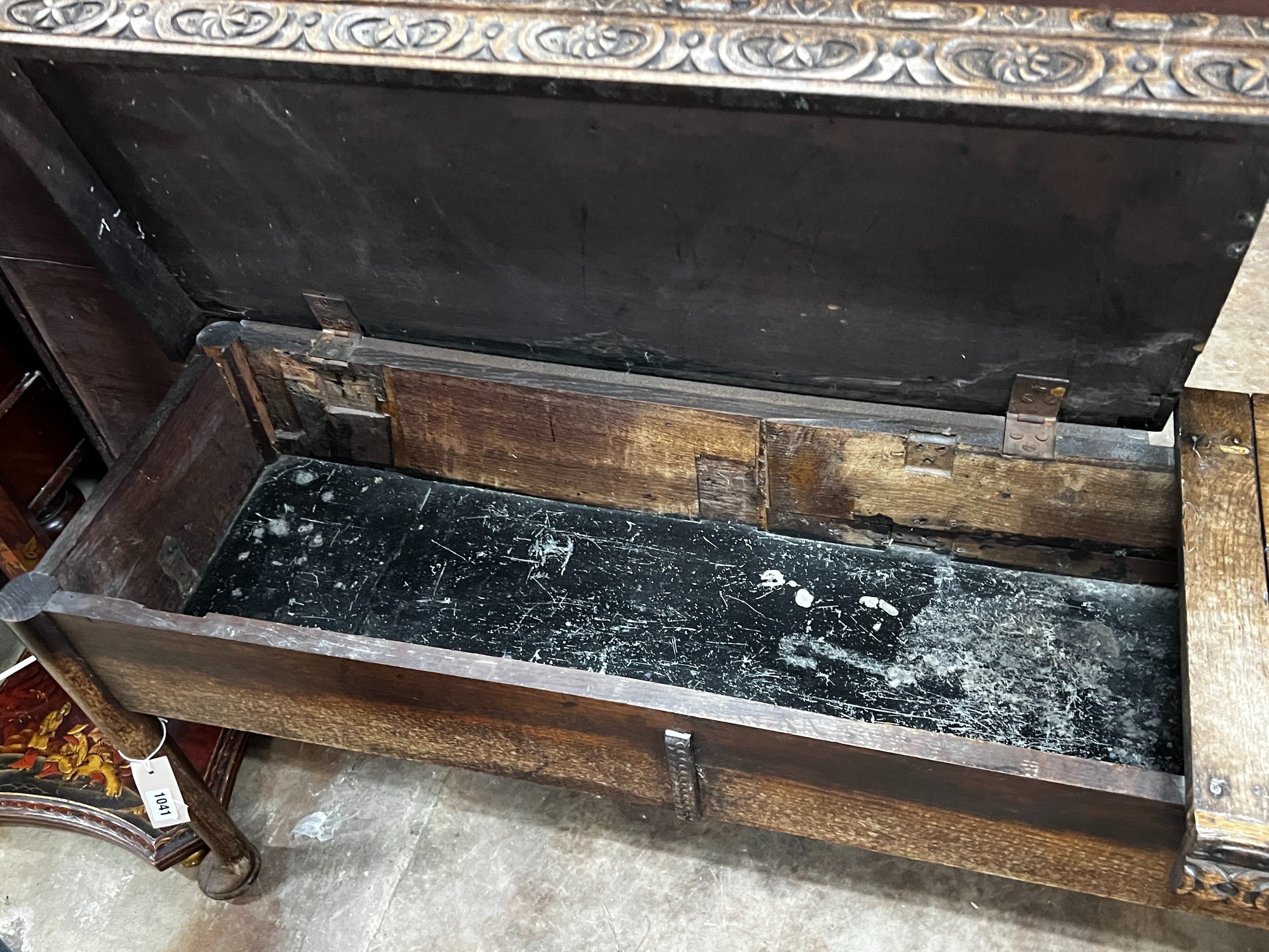 An 18th century and later carved oak hall bench with twin hinged box seat, width 183cm, depth 40cm, height 55cm